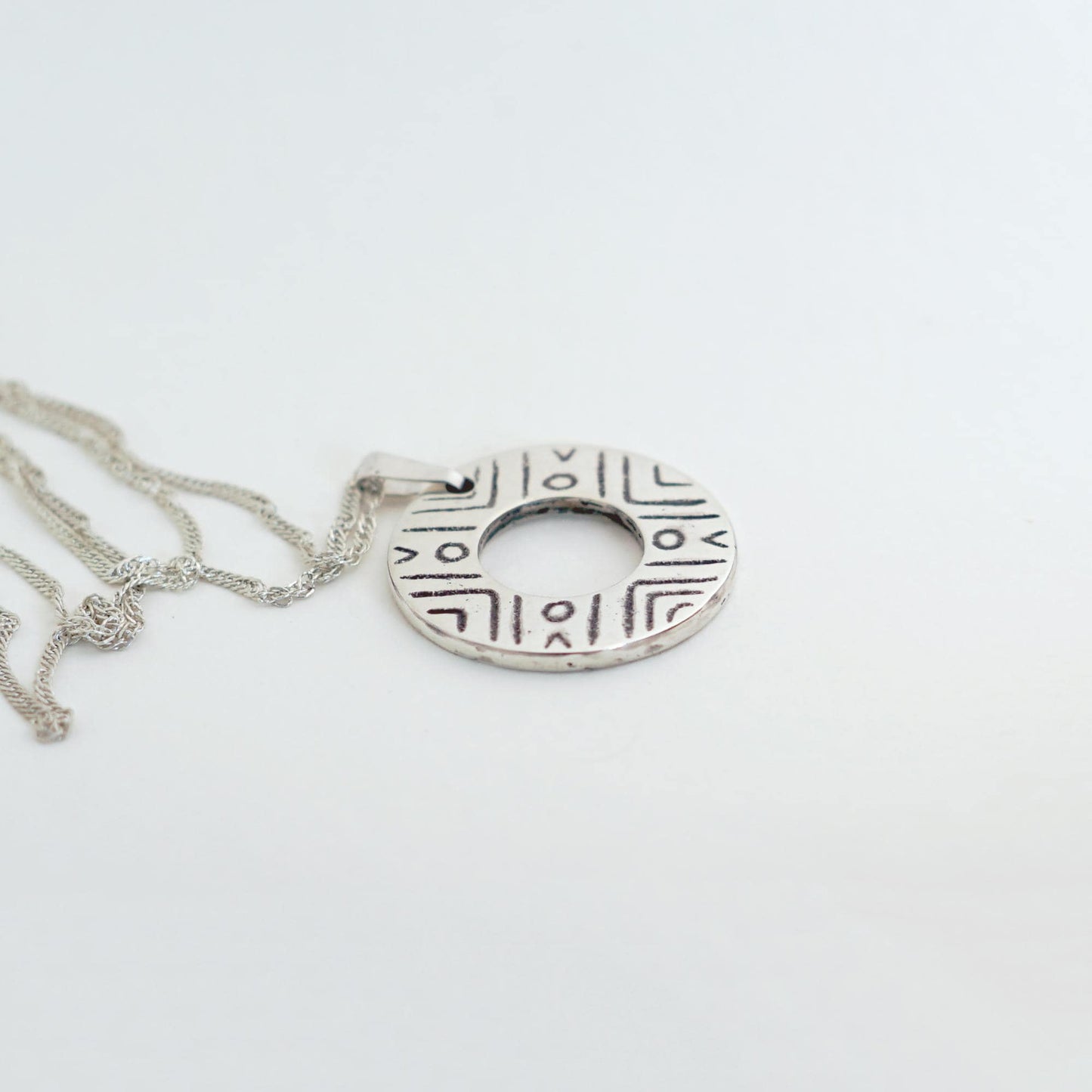 Sterling Silver donut shaped pendant with geometric pattern | Handmade circle necklace with ethnic design