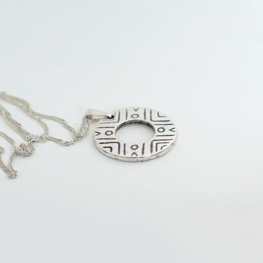 Sterling Silver donut shaped pendant with geometric pattern | Handmade circle necklace with ethnic design