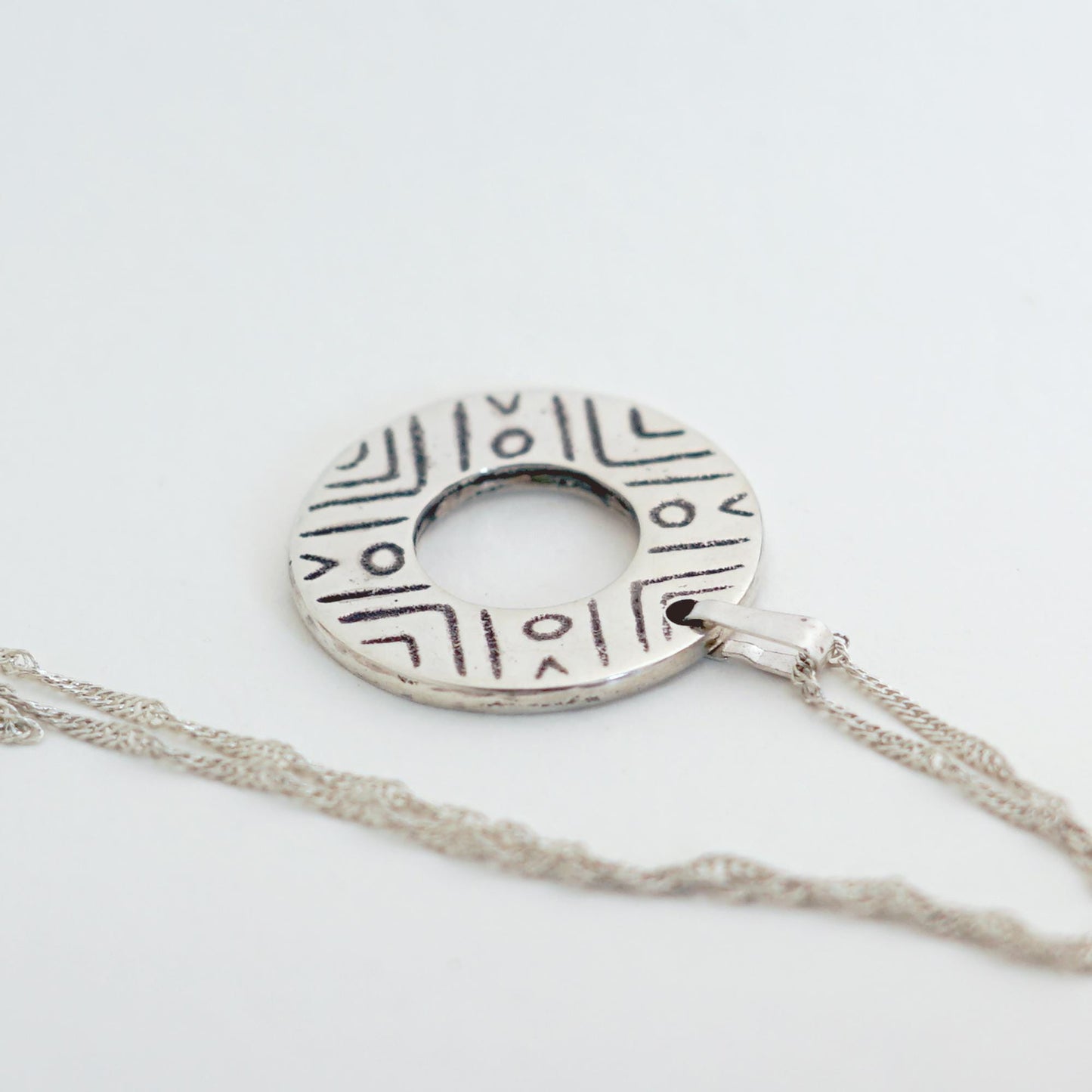 Sterling Silver donut shaped pendant with geometric pattern | Handmade circle necklace with ethnic design