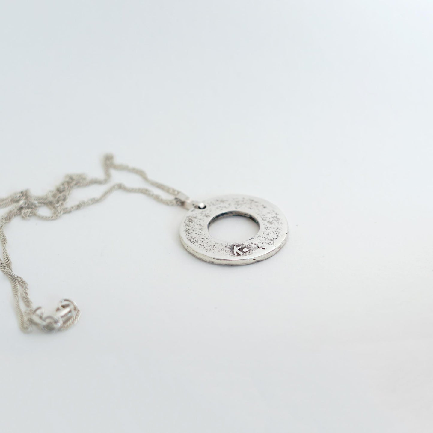 Sterling Silver donut shaped pendant with geometric pattern | Handmade circle necklace with ethnic design